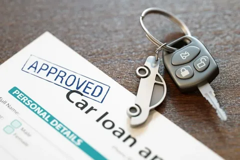 Approved car loan application with car keys on a table, symbolizing successful financing for vehicle purchase.